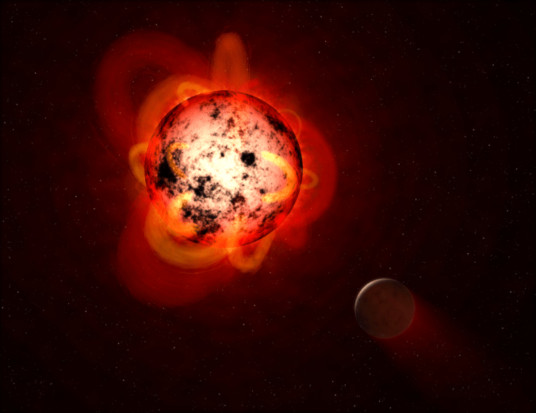 上图显示一颗被假想的行星环绕的红矮星。当它们年轻时，红矮星往往具有磁性，显示出巨大的弧形突起和大量的太阳黑子。红矮星也会爆发强烈的耀斑，随着时间的推移，可能会剥离附近行星的大气层，或者使其表面不适合生命存在。（NASA/ESA）